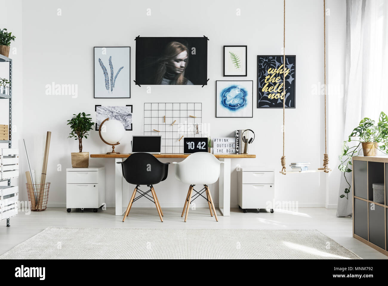 Creative Home Office With Double Desk And Two Chairs Stock Photo