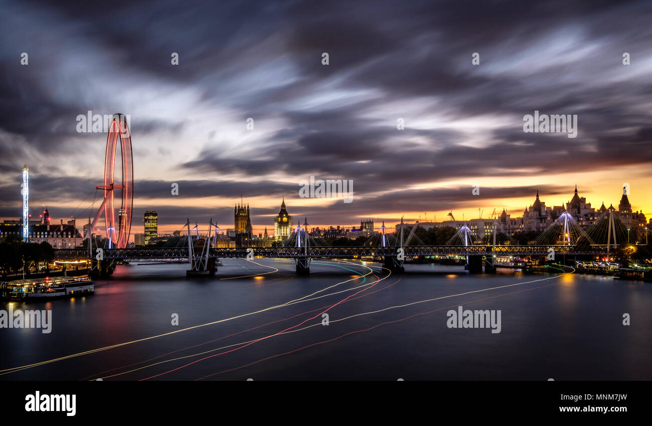 Beautiful late october sunset last evening with quite a bit of drama in the sky, captured from Waterloo Bridge with the London Eye and Big Ben on disp Stock Photo