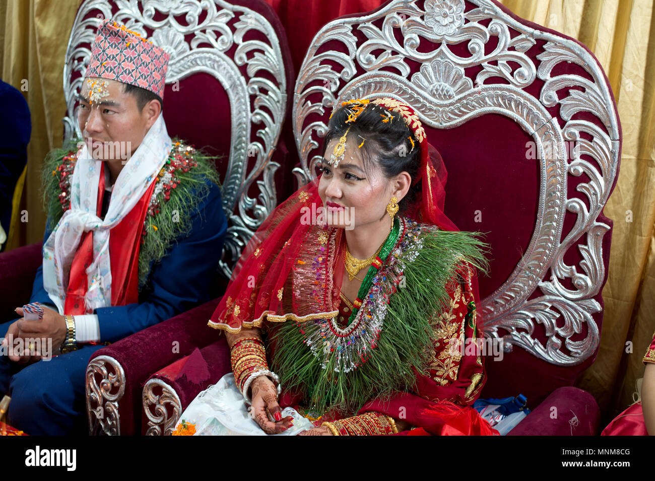 Nepal, Kathmandu. A wedding. The bride and groom on their thrones. Stock Photo