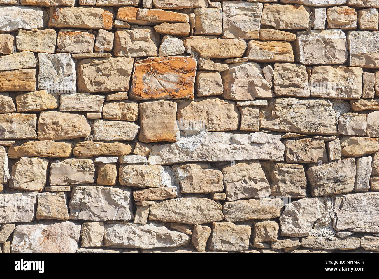 Natural stone wall to use as background Stock Photo