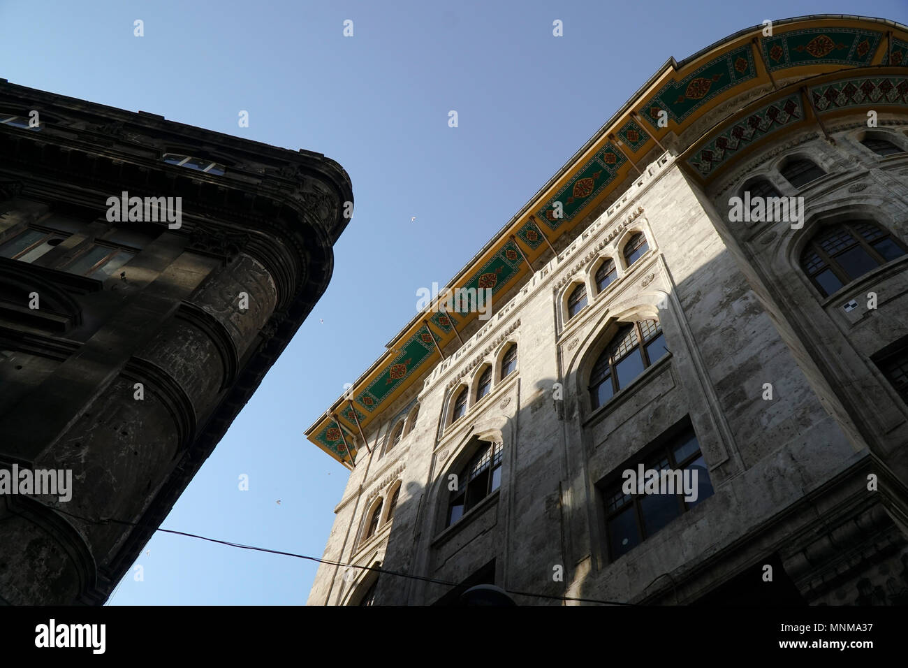 Istanbul, Turkey - May 17, 2018: Historical stone buildings are at Eminonu District at Istanbul with blue sky. Stock Photo