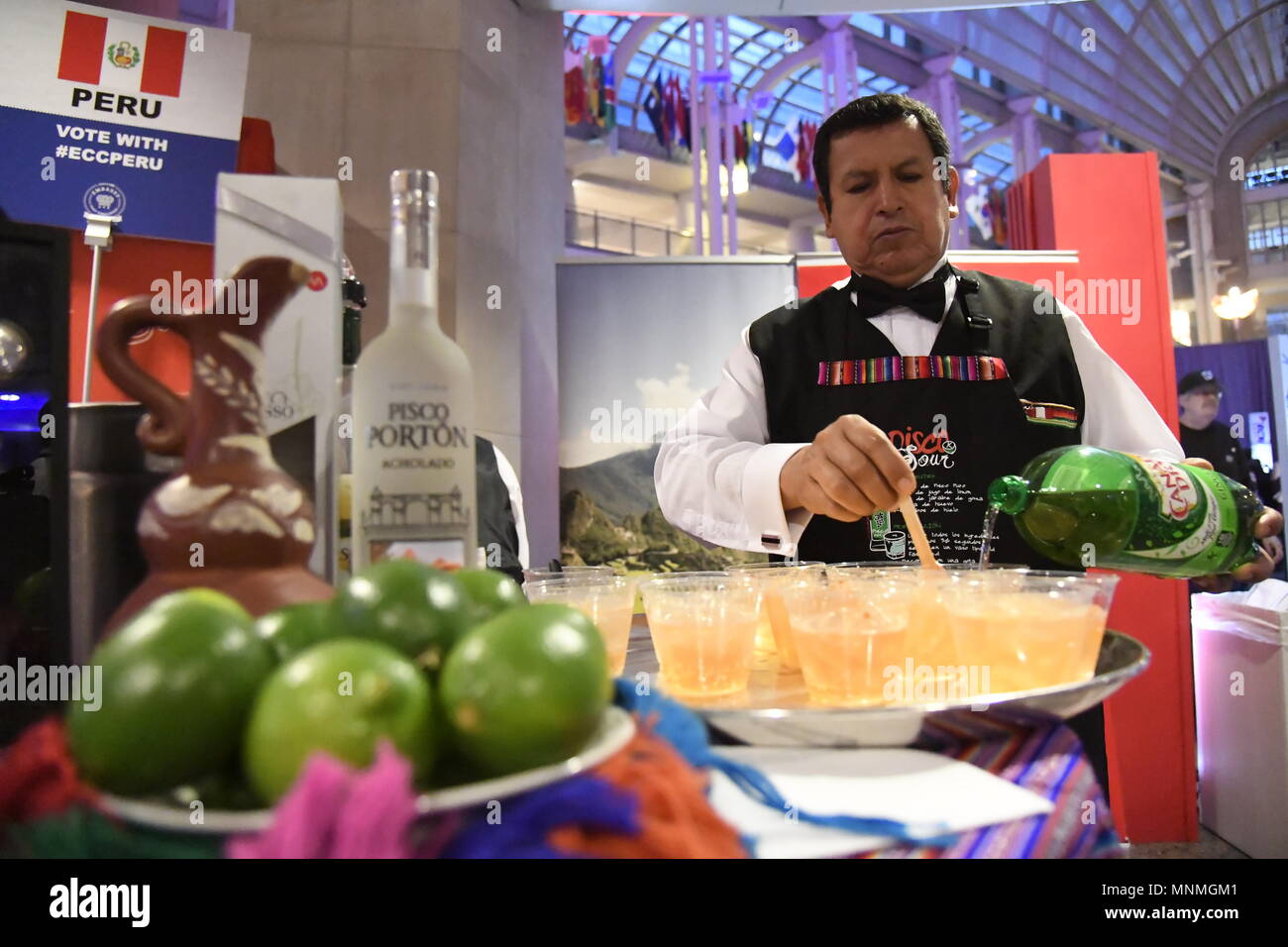 Washington, USA. 17th May, 2018. A chef from the Peru Embassy makes cocktail for guests in the 2018 Embassy Chef Challenge, in Washington, DC, the United States, May 17, 2018. Chefs from over 25 different embassies across the U.S. capital gathered at the Ronald Reagan Building and International Trade Center in downtown Washington, DC Thursday evening for the 10th annual Embassy Chef Challenge. Credit: Yang Chenglin/Xinhua/Alamy Live News Stock Photo