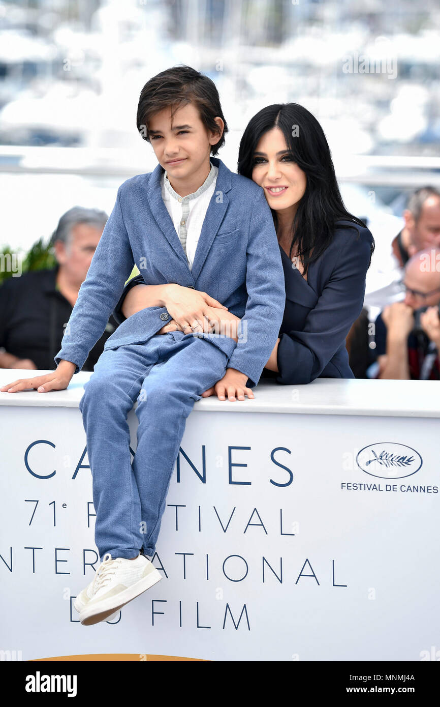 Cannes, Cannes International Film Festival in Cannes. 18th May, 2018. Actor Zain Al Rafeea (L) and director Nadine Labaki of the film 'Capernaum', pose during a photocall of the 71st Cannes International Film Festival in Cannes, France on May 18, 2018. The 71st Cannes International Film Festival is held from May 8 to May 19. Credit: Chen Yichen/Xinhua/Alamy Live News Stock Photo