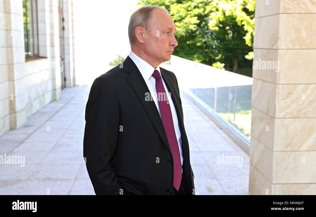 Russian President Vladimir Putin waits to greet Syrian President Bashar al-Assad at his Black Sea resort residence May 17, 2018 in Sochi, Russia.   (Russian Presidency via Planetpix) Stock Photo