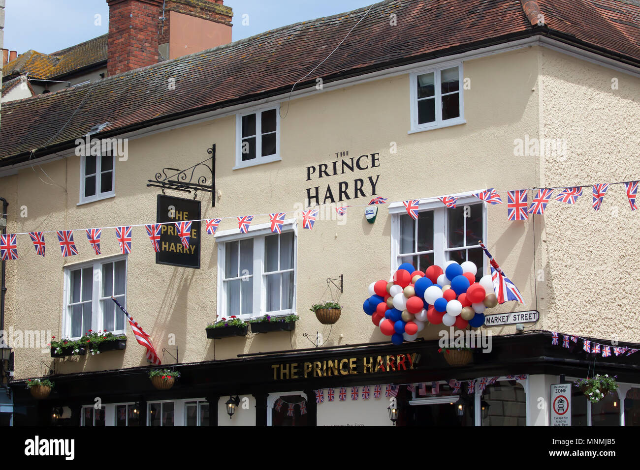 Windsor,UK,18th May 2018,The Royal Wedding preparations get underway as excitement builds in Windsor ahead of the marriage tomorrow of Prince Harry to Meghan Markle. There is an increased police presence and the shops are full of wedding souvenirs also lamp posts are adorned with union jack flags. Large crowds have descended on the town to soak up the atmosphere.Credit Keith Larby/Alamy Live News Stock Photo