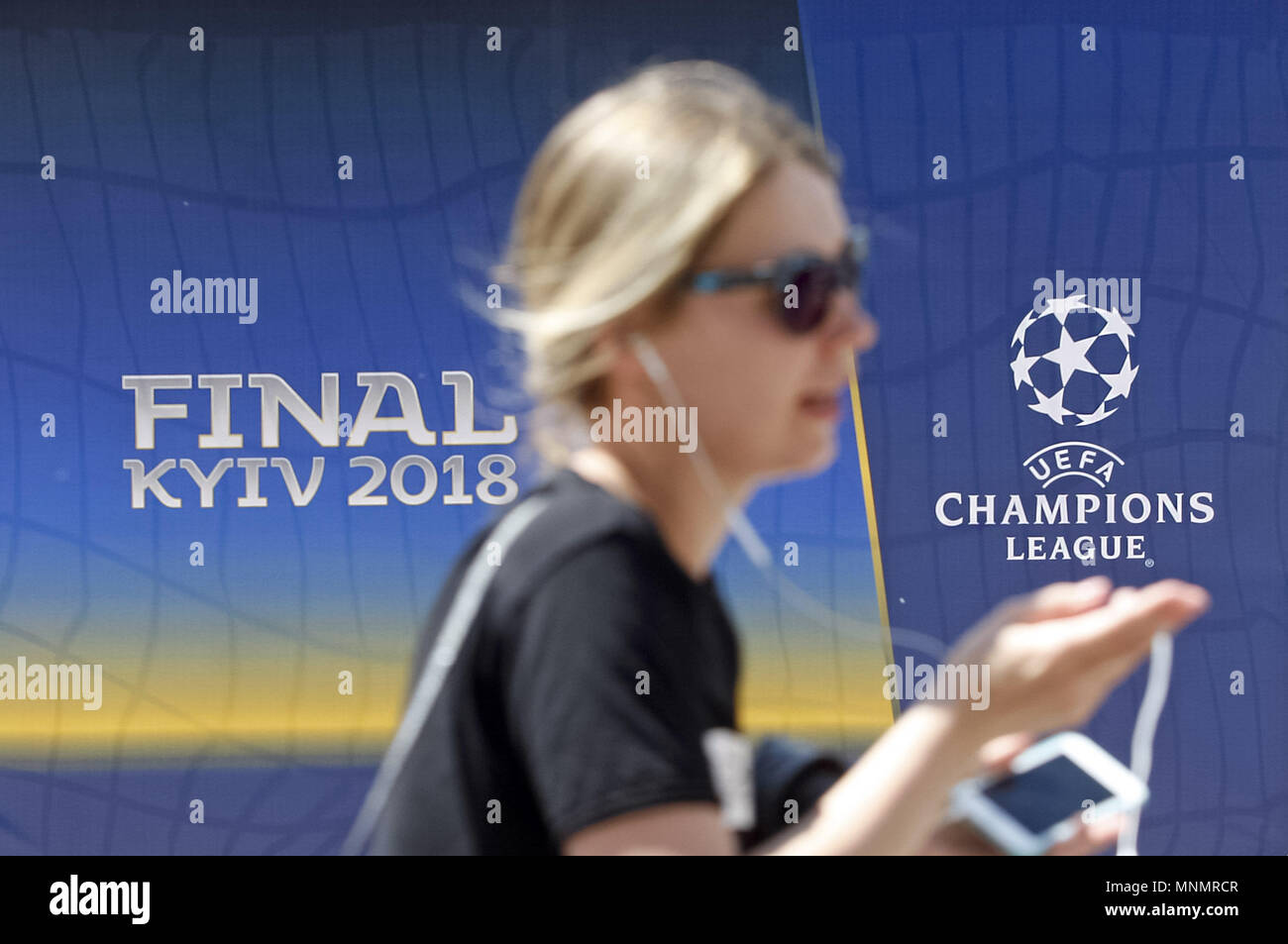 Kiev Ukraine 18th May 18 A Girl Walks In Front Of The Uefa Champions League Final 18 Logo In Center Of Kiev Ukraine On 18 May 18 Real Madrid Will Face Liverpool