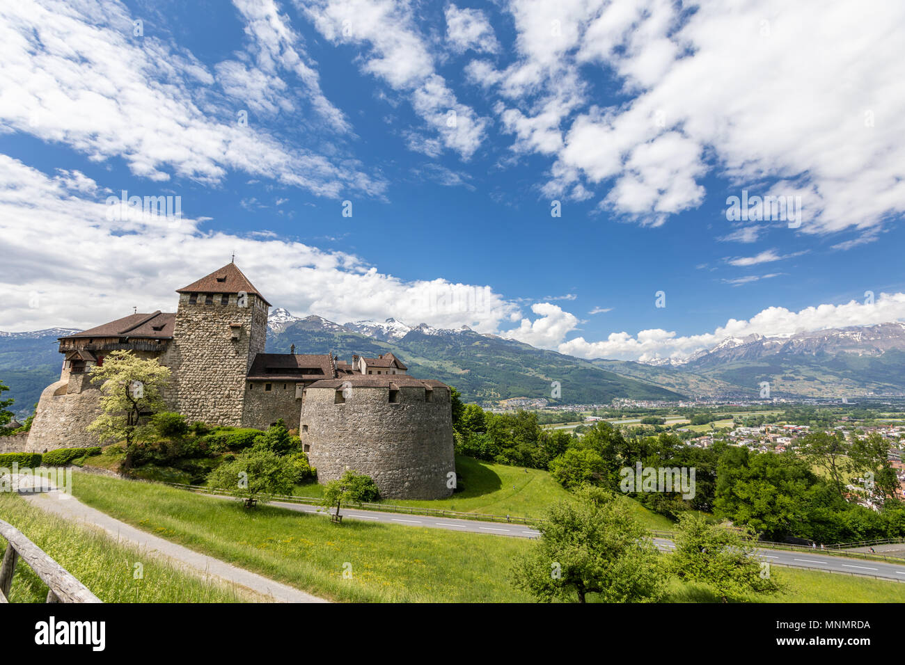 Vaduz Castle with mountain road in Liechtenstein. Alps landscape ...