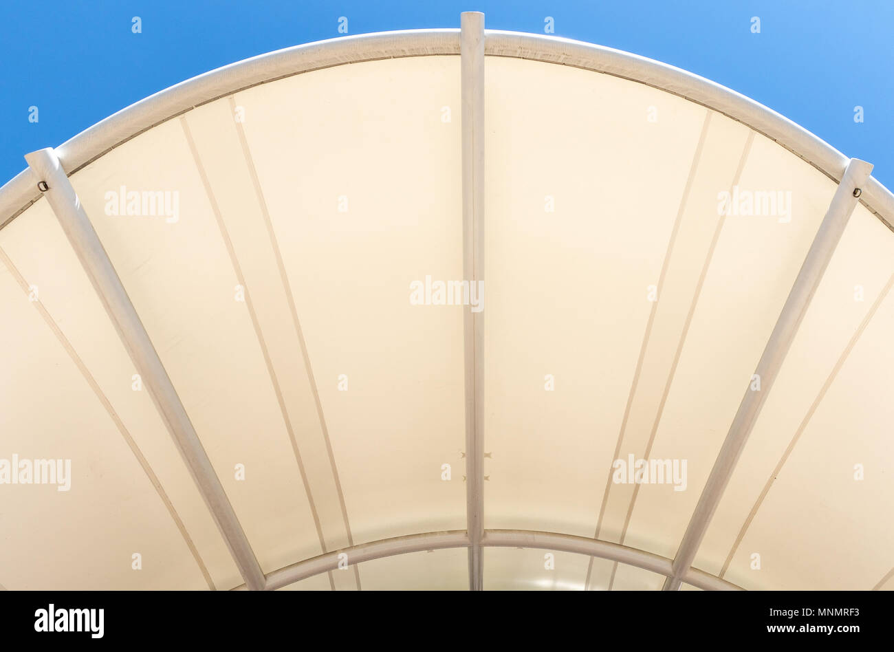The roof (awning) of the amphitheatre in Pack Square, Asheville, NC, USA, forming a symmetric pattern against a blue sky. Stock Photo
