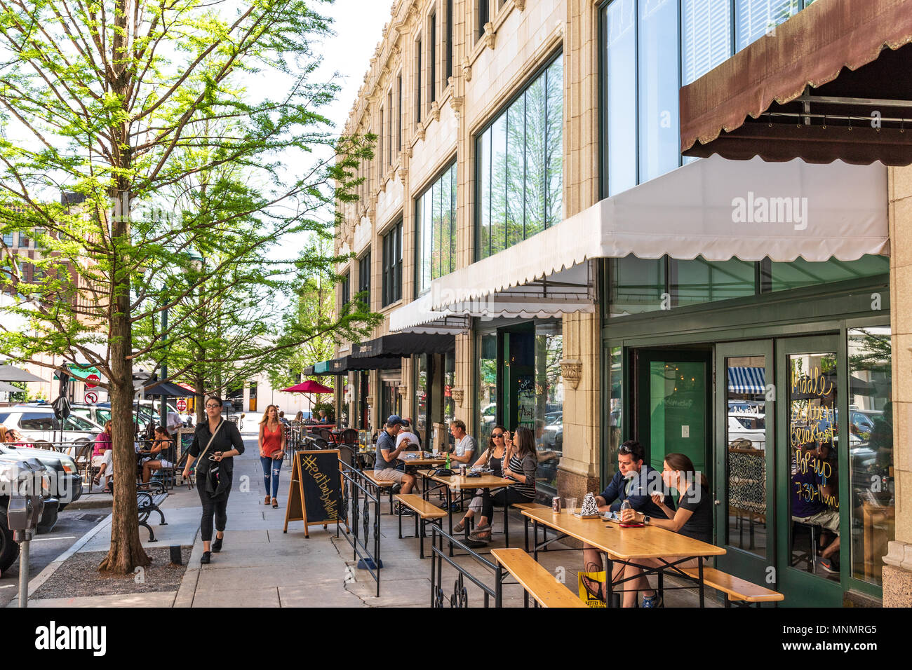 ASHEVILLE, NC, USA-13 MAY 18:Diners relaxing on Page Avenue in downtown Asheville, NC, USA on a warm, sunny, spring day. Stock Photo