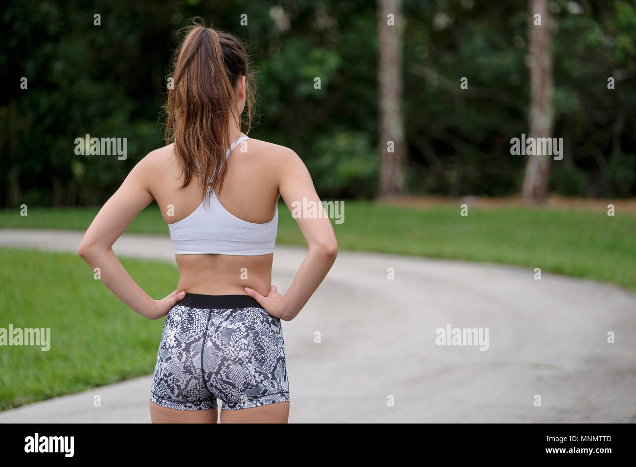 Rear view of woman jogging in park Stock Photo