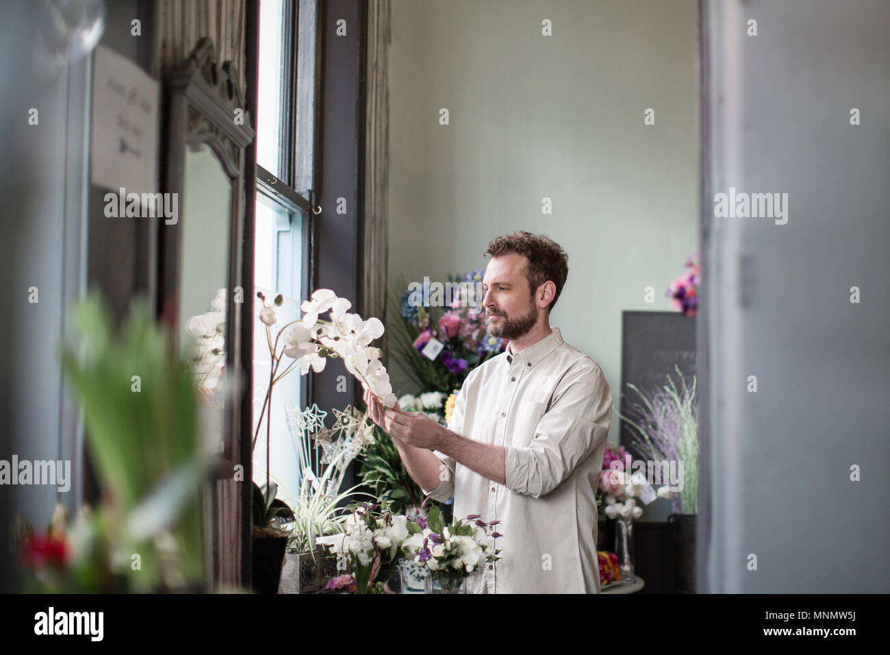 Florist working in store Stock Photo