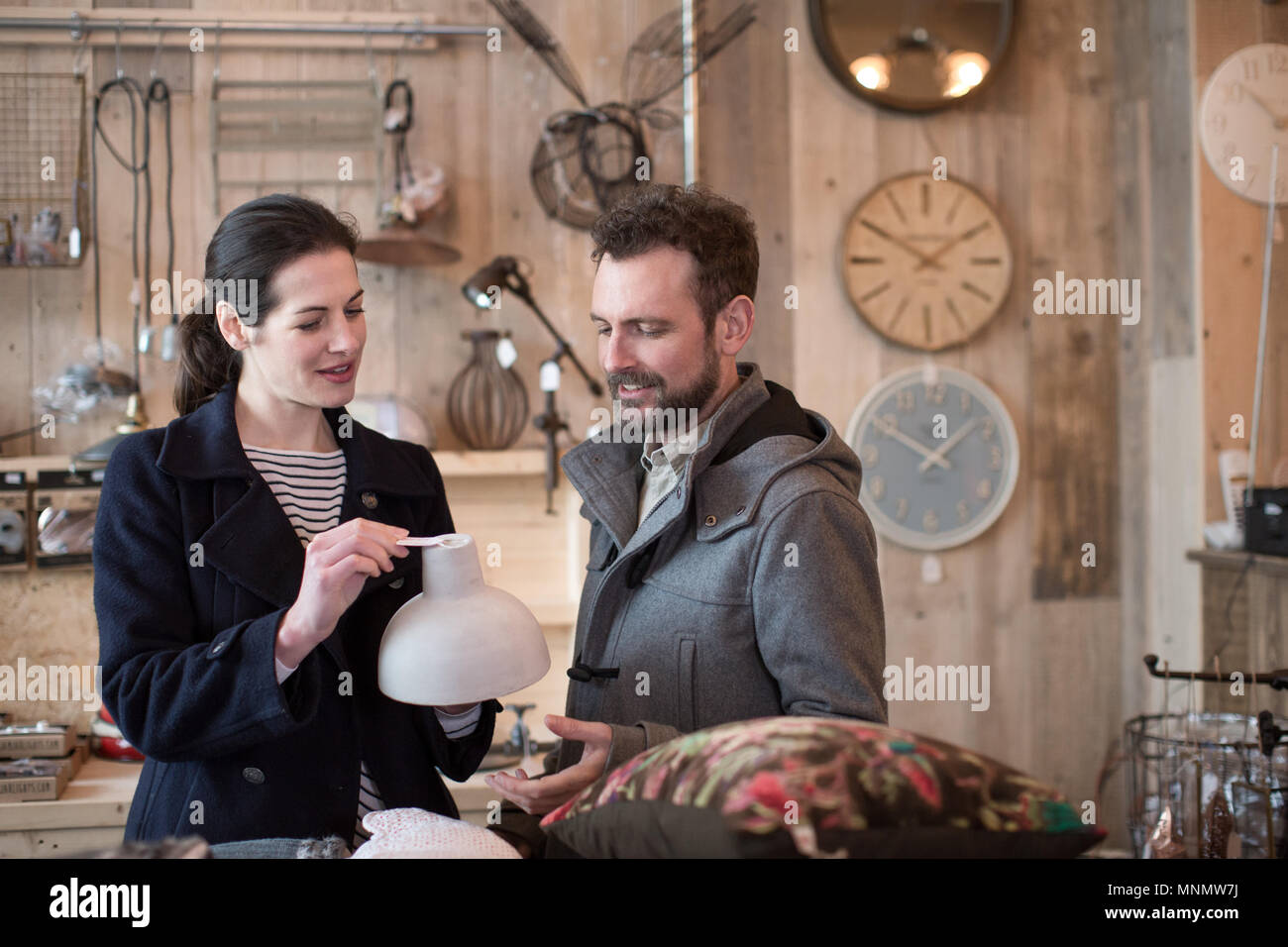 Couple looking at price tags in a home store Stock Photo
