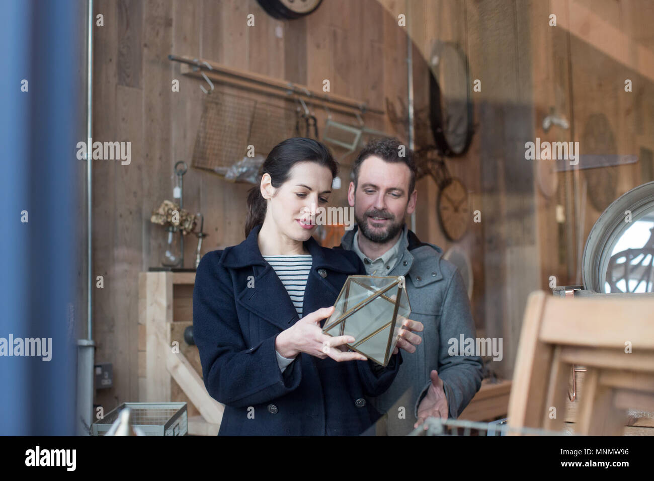 Couple looking shopping in vintage antique store Stock Photo