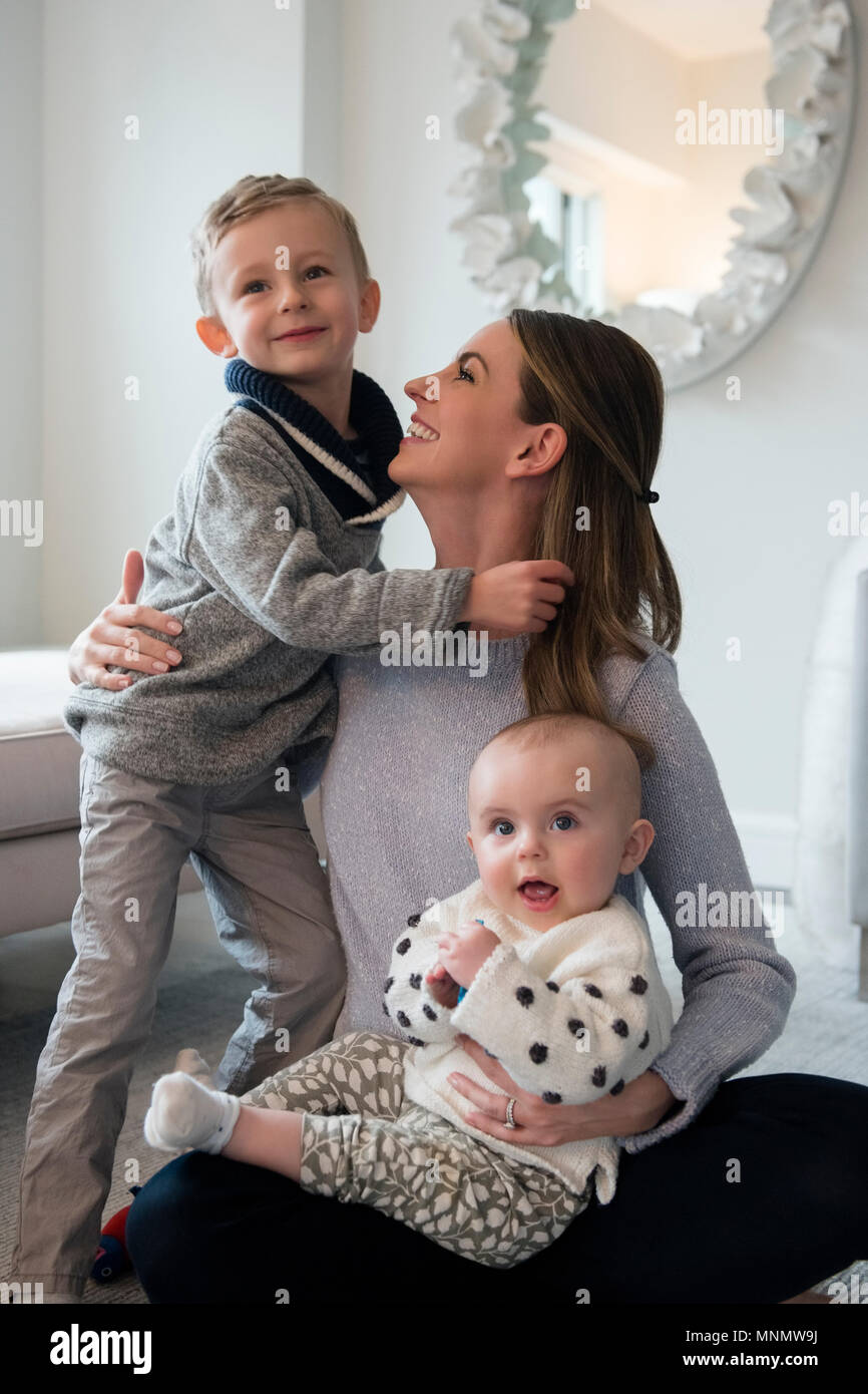 Happy mother spending time with children (18-23 months, 4-5) Stock Photo