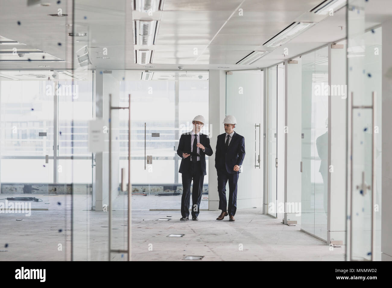 Businessman looking at new office space Stock Photo