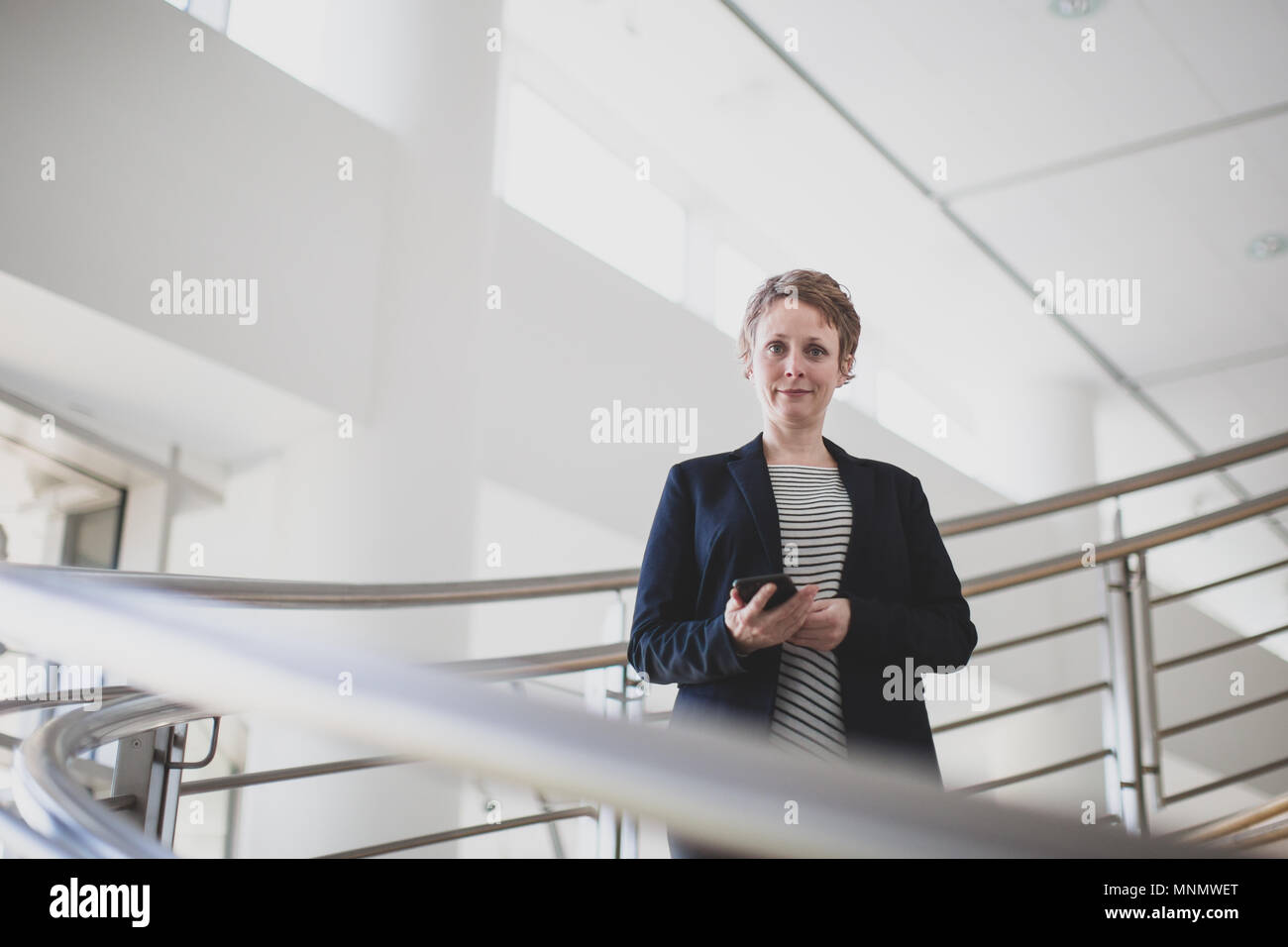 Portrait of businesswoman in a modern office Stock Photo - Alamy