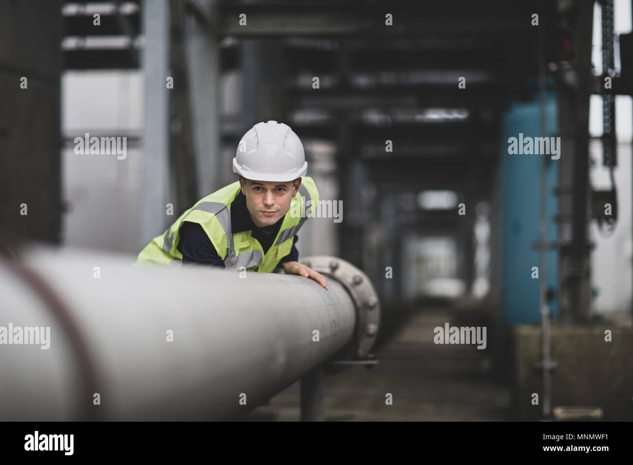 Industrial worker checking pipeline Stock Photo