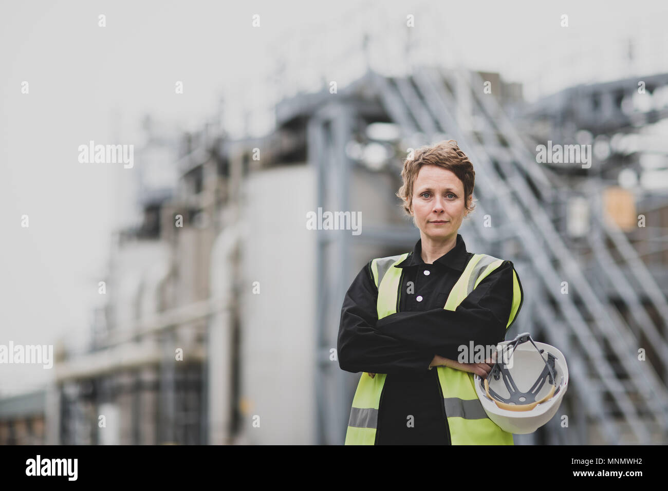 Portrait of female industrial worker on site Stock Photo
