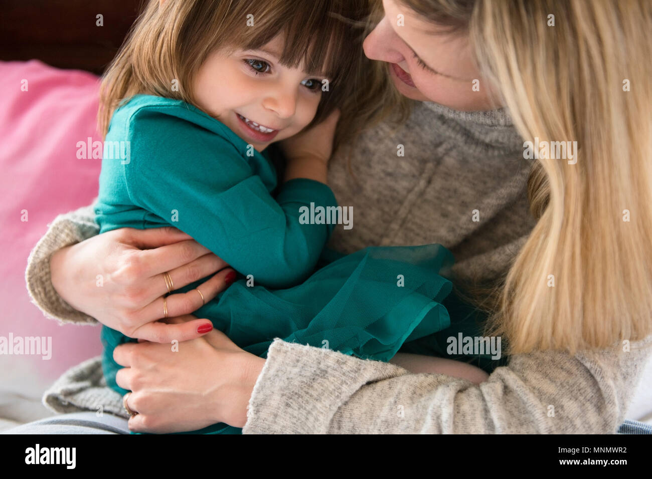 Mother holding daughter (2-3) Stock Photo