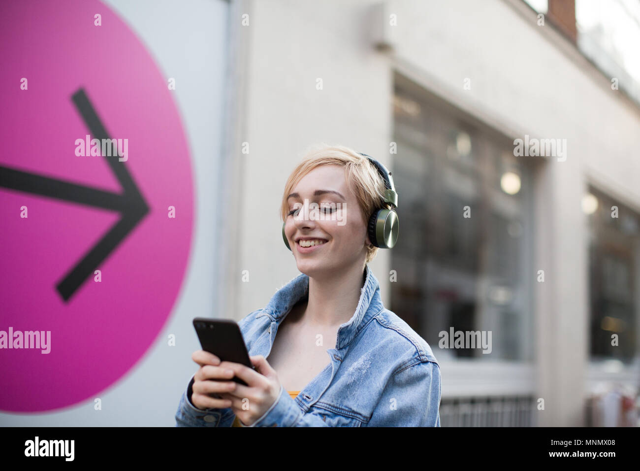 Young adult female streaming music Stock Photo