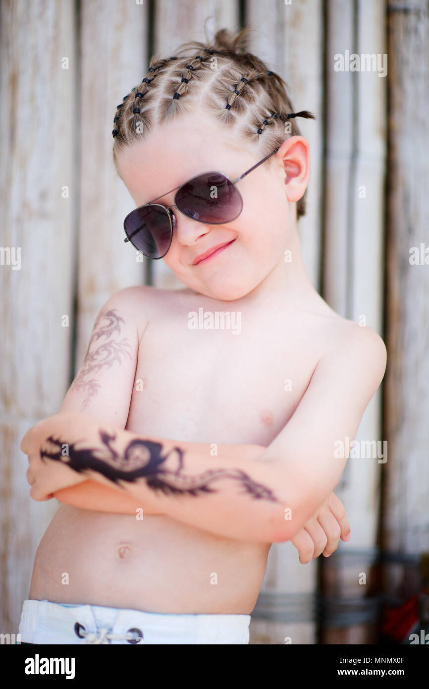 Cute 5 years old boy with african style hair and henna tattoo Stock Photo -  Alamy