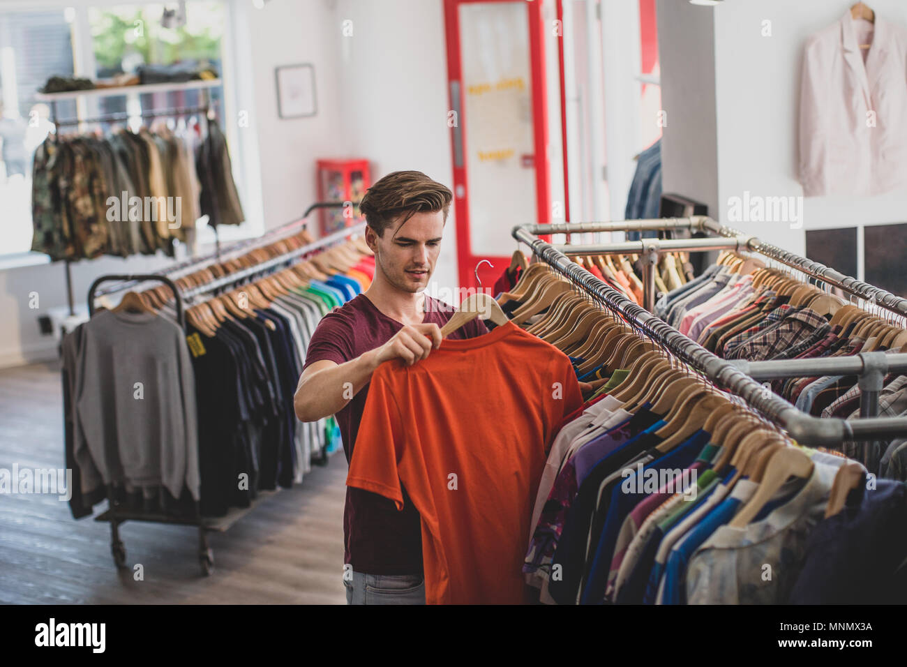 Young adult male clothes shopping Stock Photo