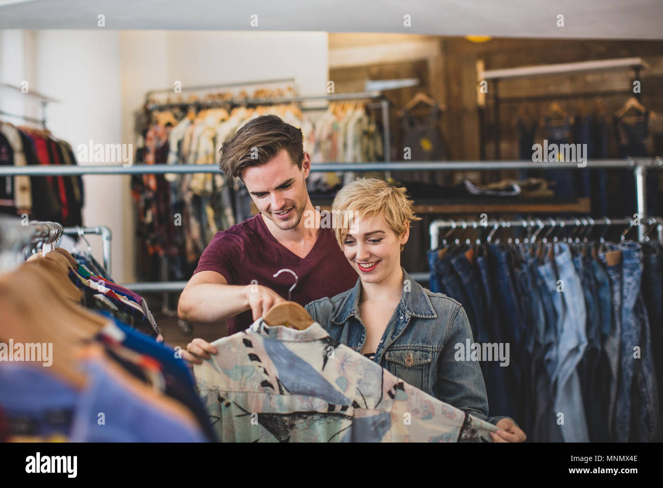 Millennial couple in a vintage clothing store Stock Photo