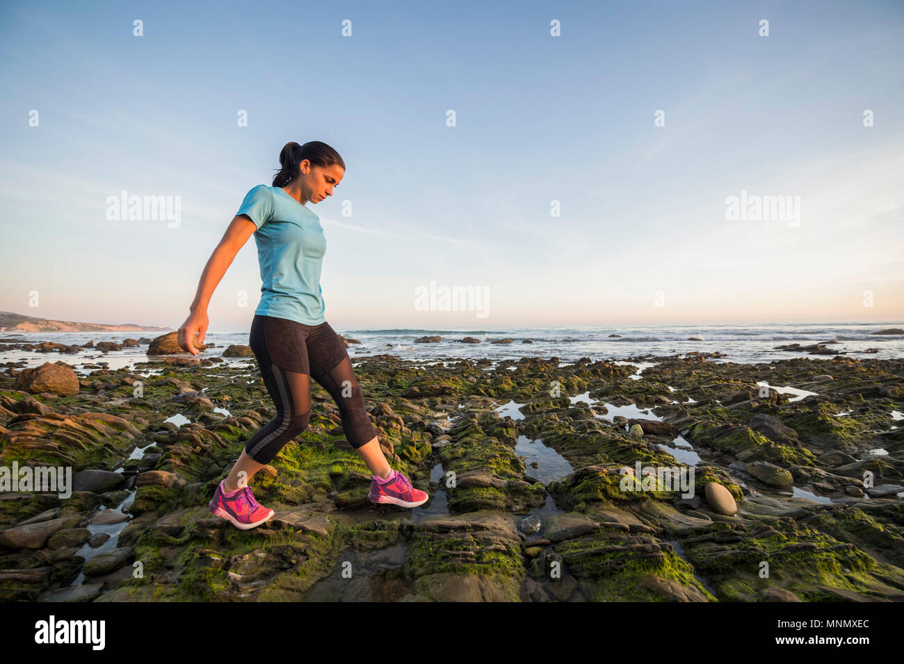USA, California, Newport Beach, Woman exercising on beach Stock Photo
