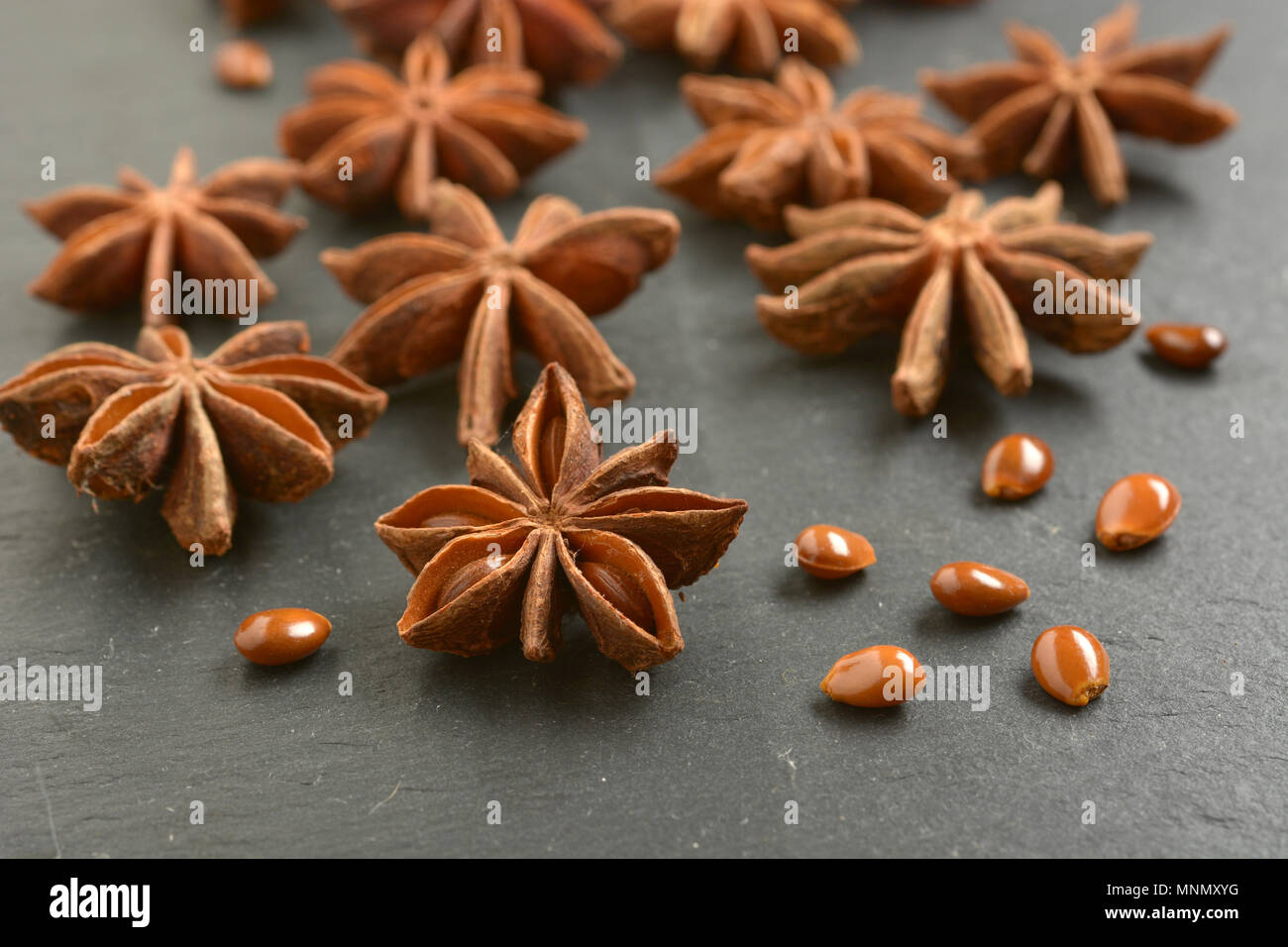 star anise on slate chopping board - closeup Stock Photo