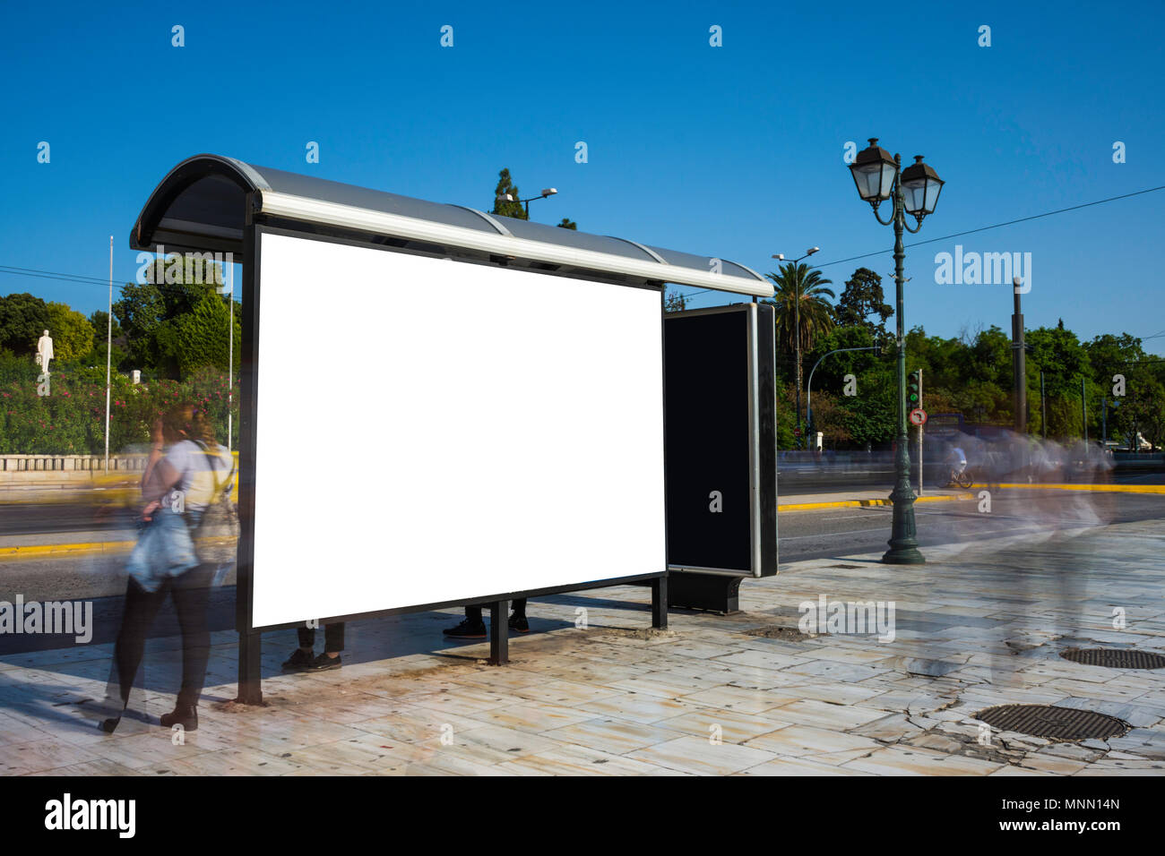 Mock up of blank white orizontal bus stop in a city, Athens Stock Photo