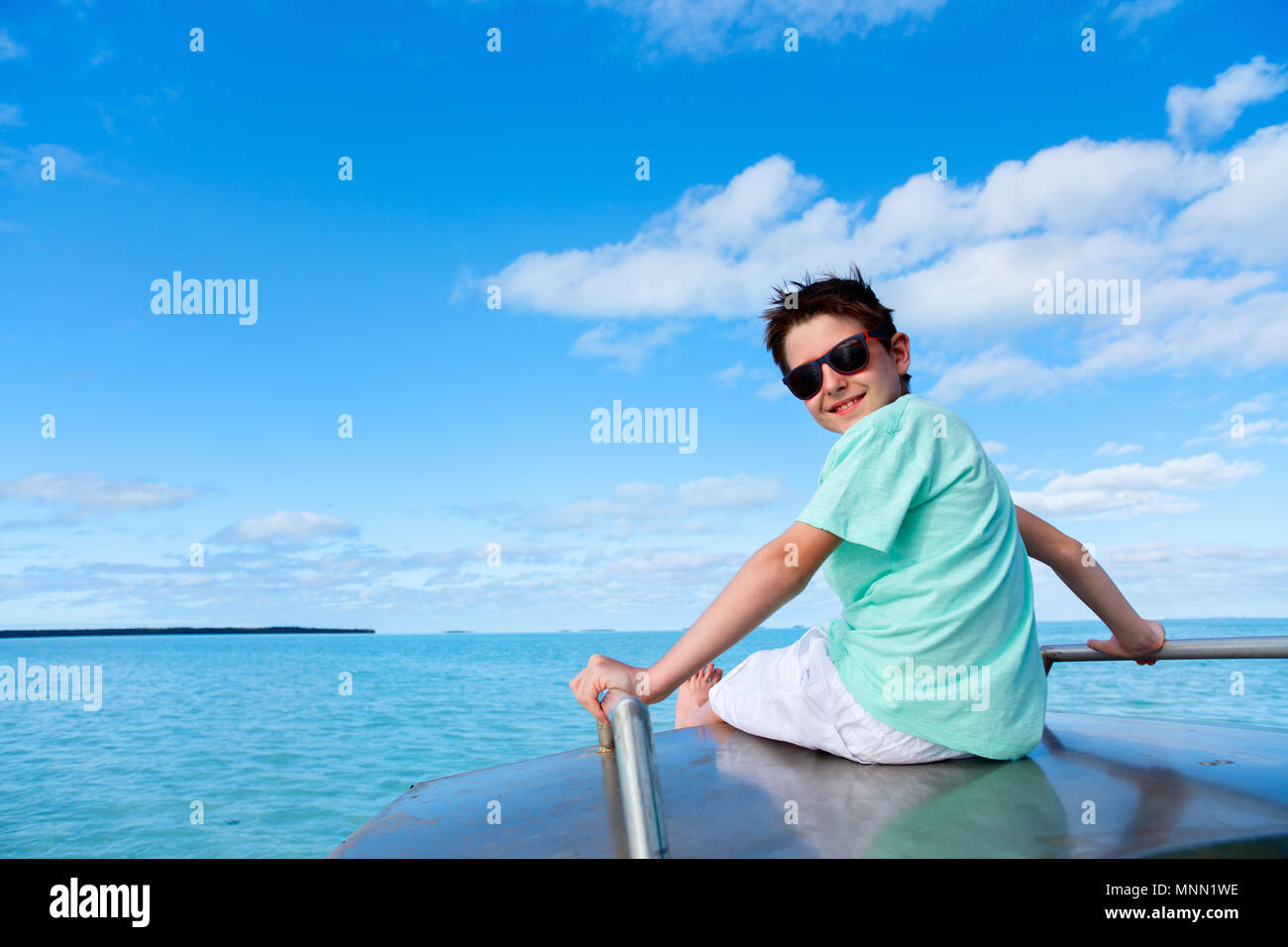 Happy boy and boat hi-res stock photography and images - Alamy