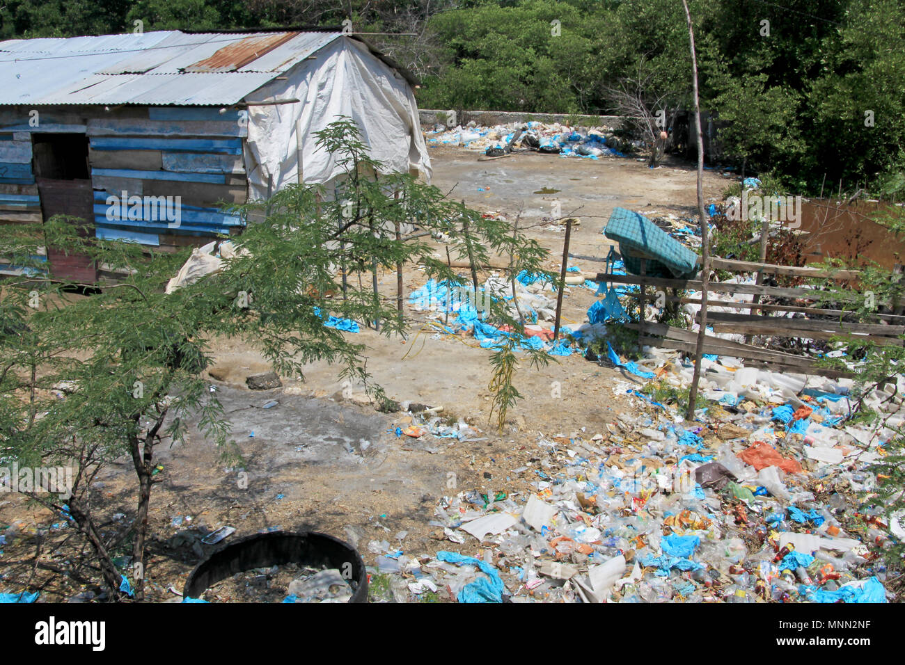 Littering of garbage in front of private houses along colombian 