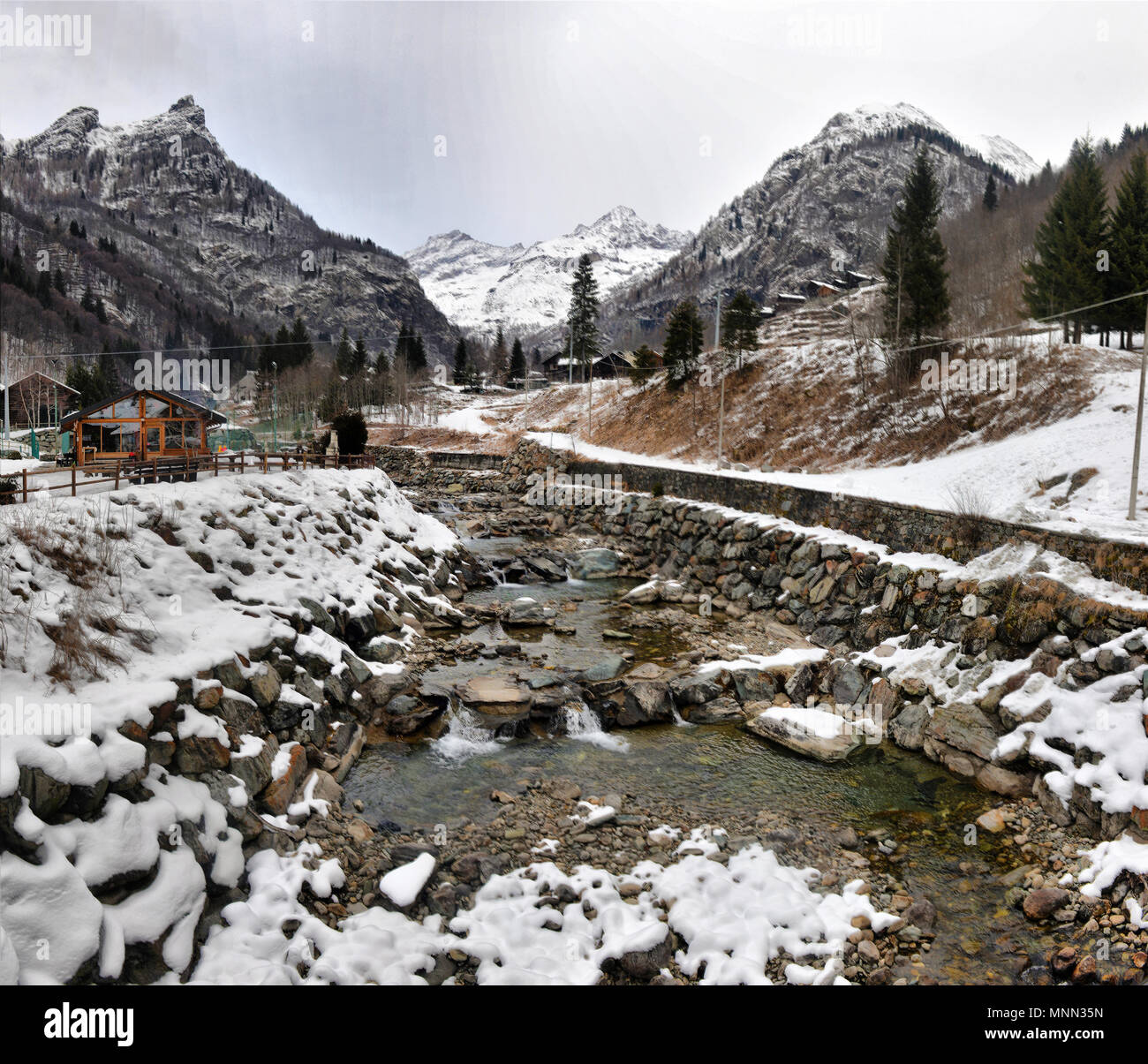 winter landscape in the Alps with the river and clouds Stock Photo - Alamy