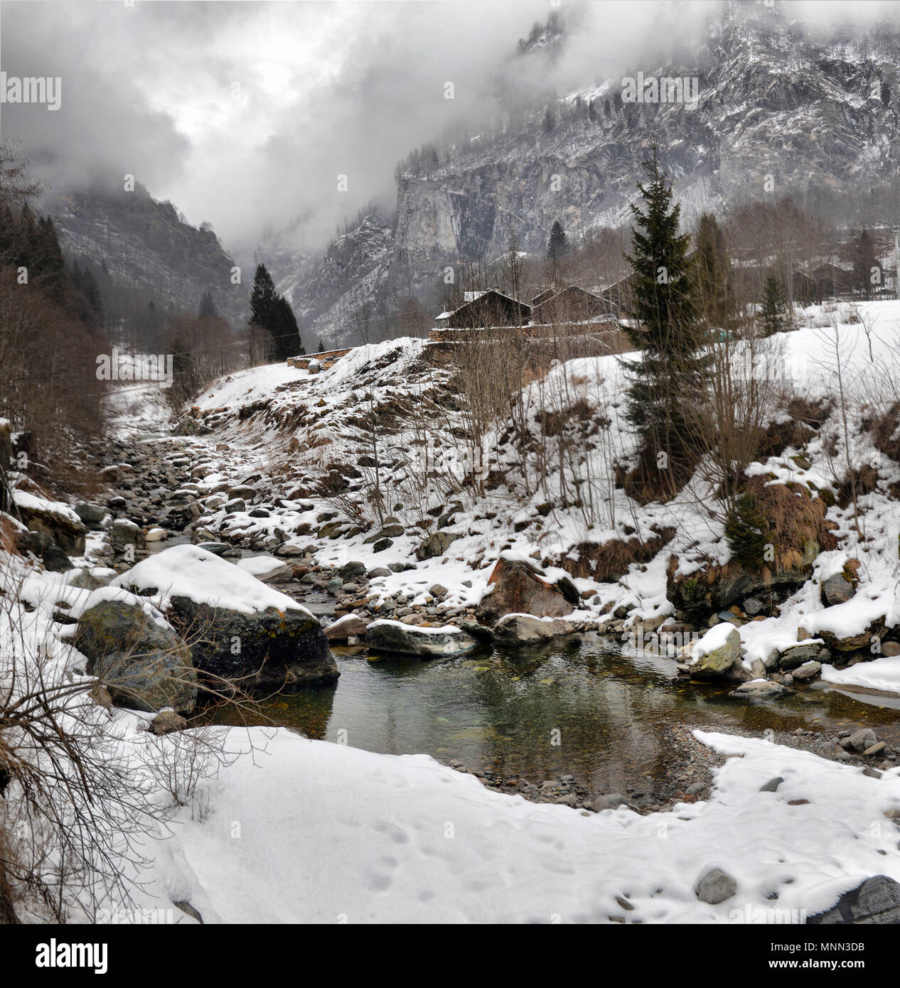 The Alps Rivers winter landscape in the Alps with the river and clouds Stock Photo - Alamy