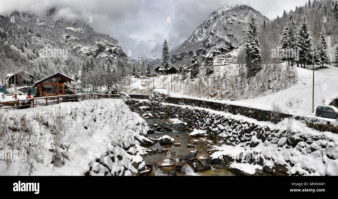 winter landscape in the Alps with the river and clouds Stock Photo - Alamy