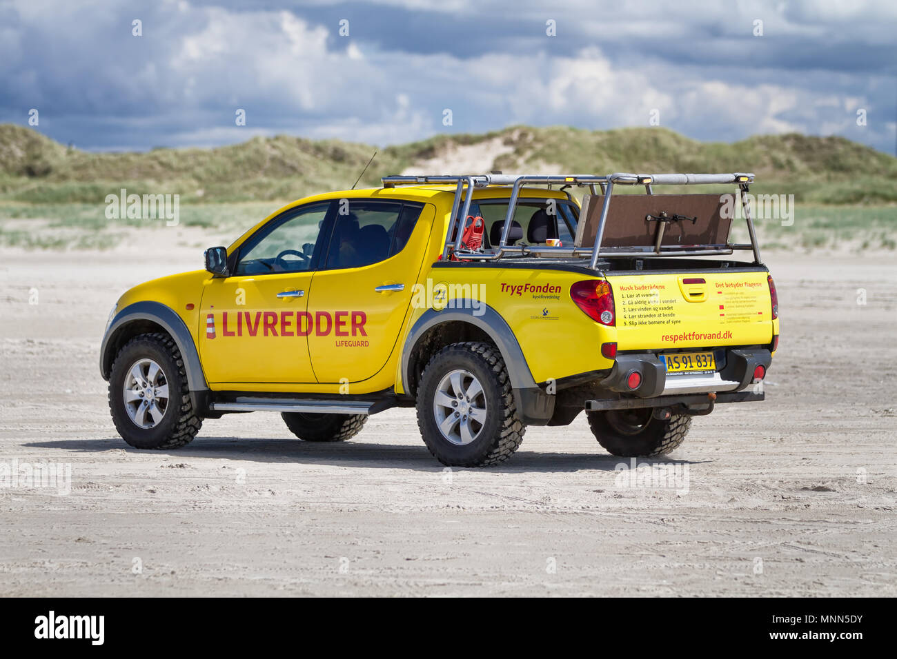 Lifeguards in a pick-up truck in denmark Stock Photo