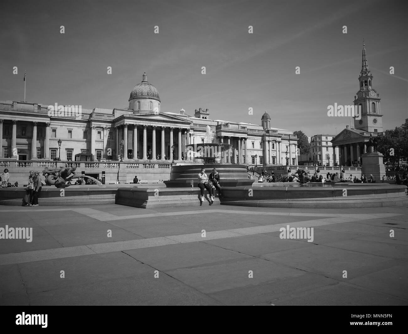 LONDON - MAY 18, 2018: ( Image digitally altered to monochrome ) Trafalgar Square and the iconic National Gallery behind Stock Photo