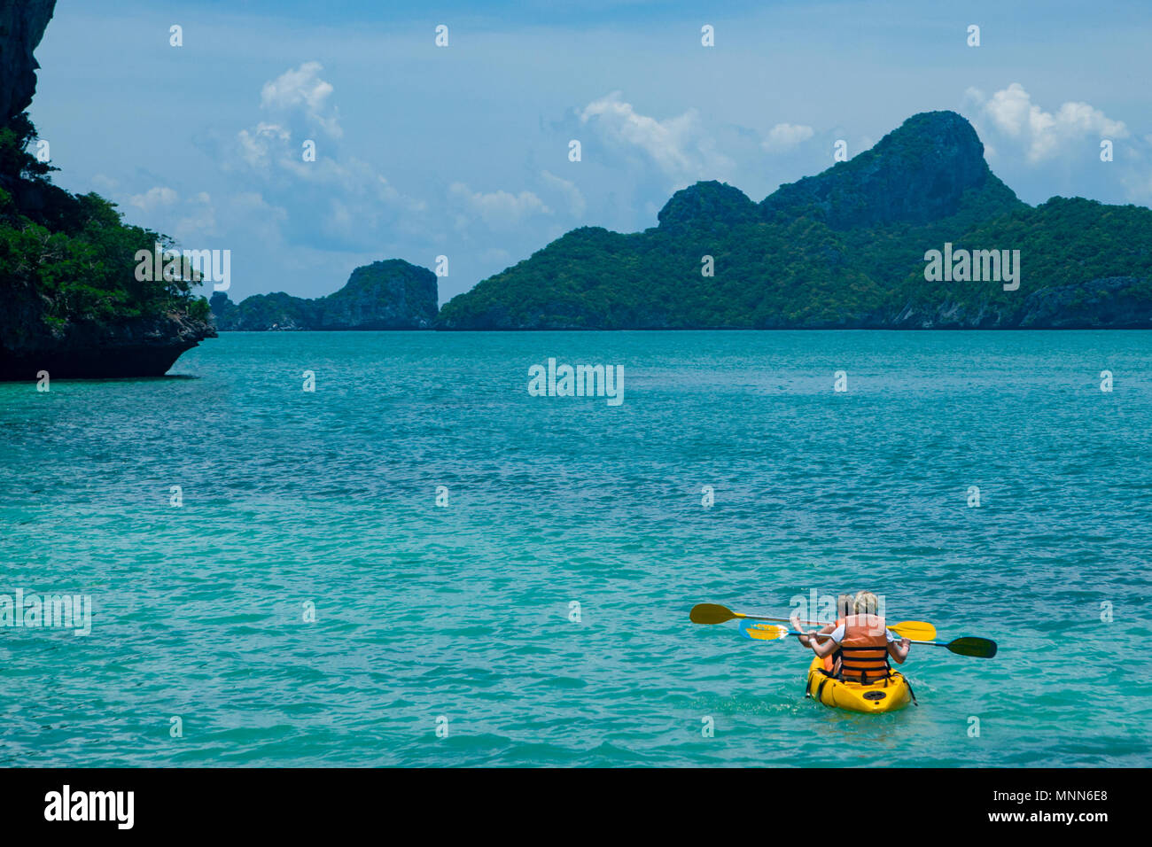 Canoe In Ocean Canoeing in the blue ocean Stock Photo - Alamy