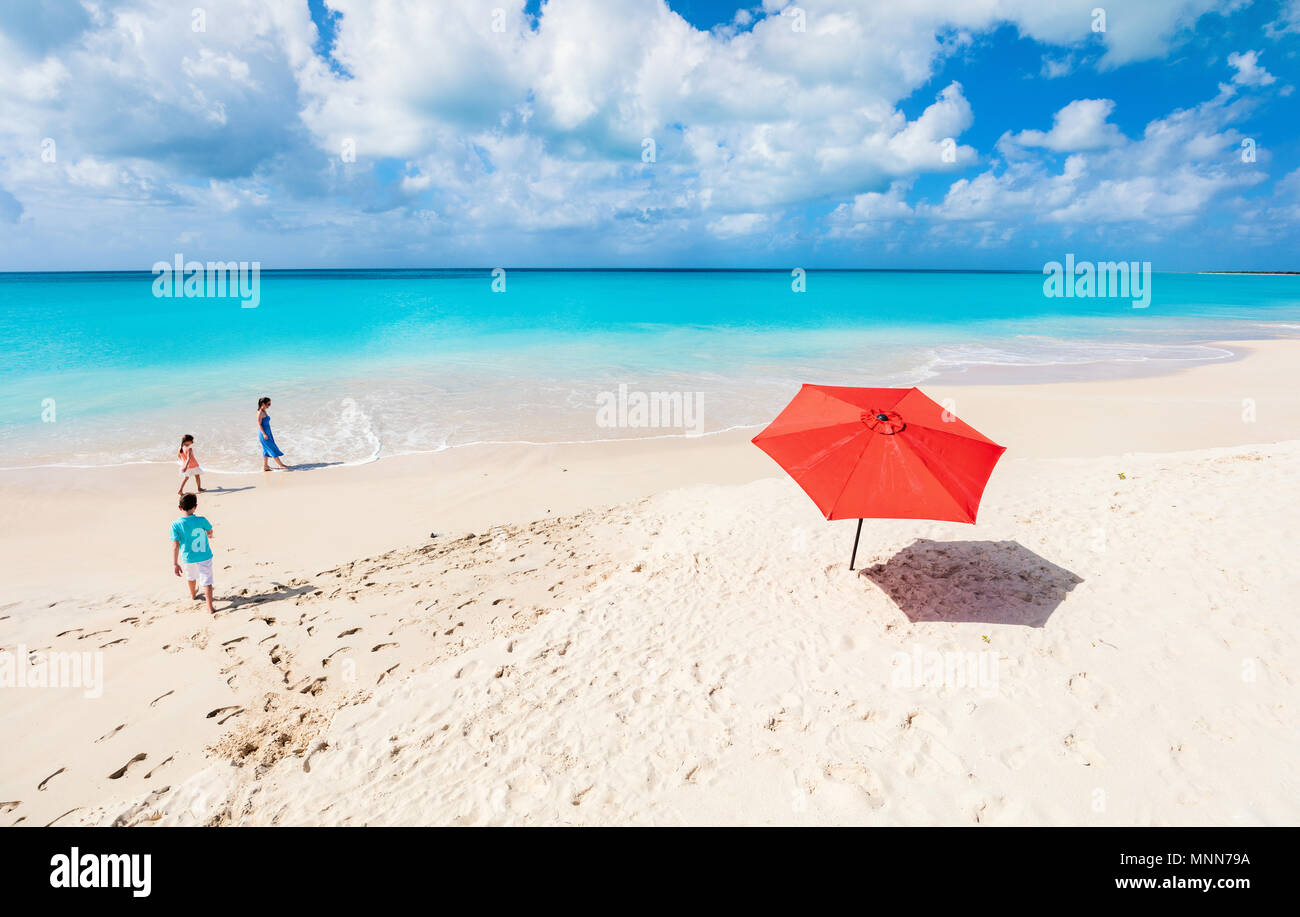 Above view of mother and kids enjoying tropical beach vacation Stock Photo....