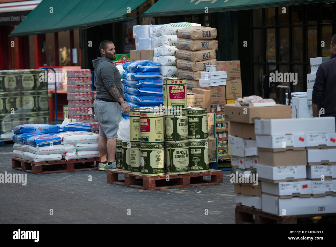 Lisle Street in London’s Chinatown with food supplies unloading for local Chinese restaurants. Stock Photo