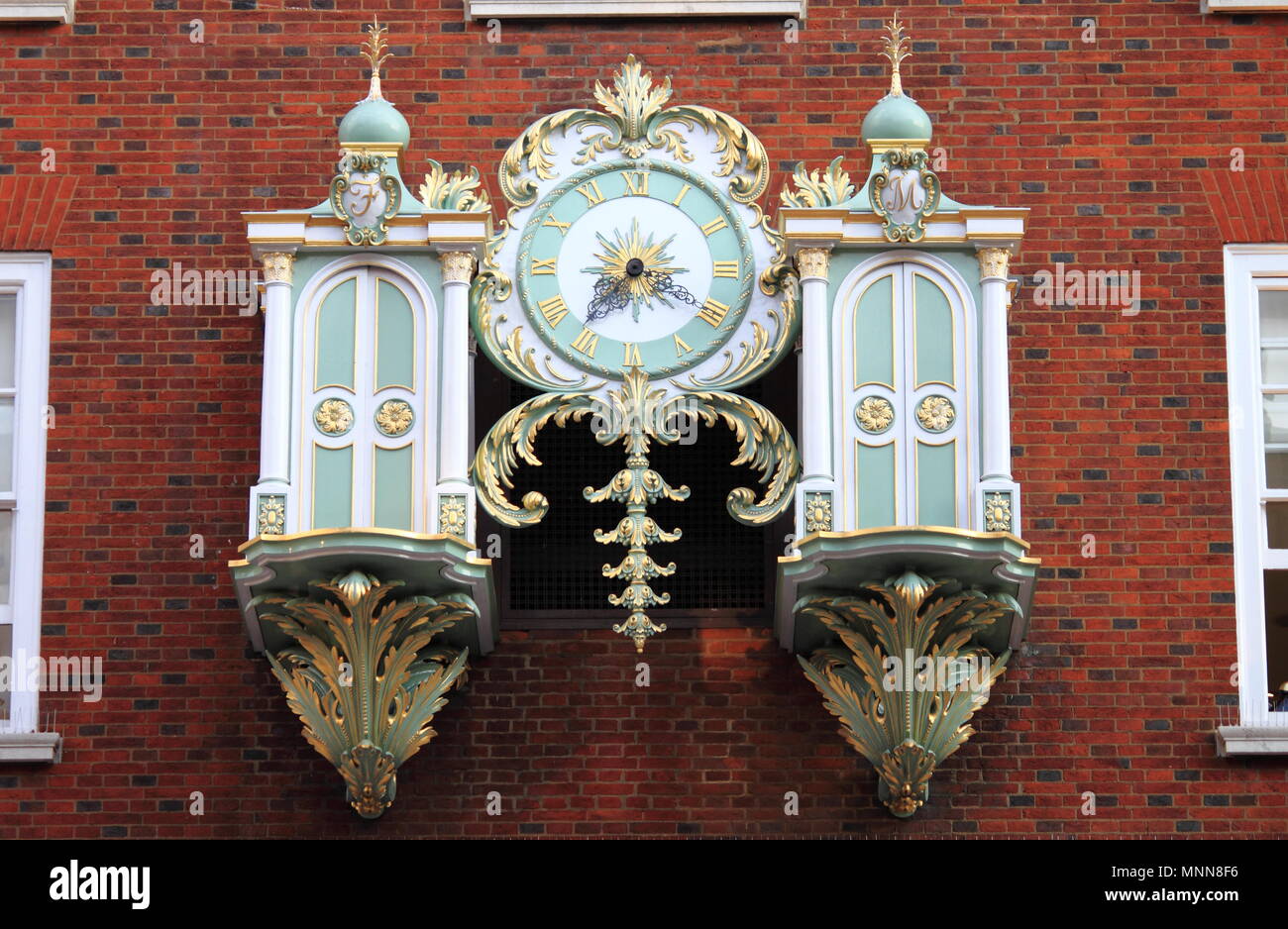 LONDON - AUGUST 7: Fortnum & Mason Department store's mechanical clock in the closed position on August 7, 2014 in London, UK. Fortnum & Mason has bee Stock Photo