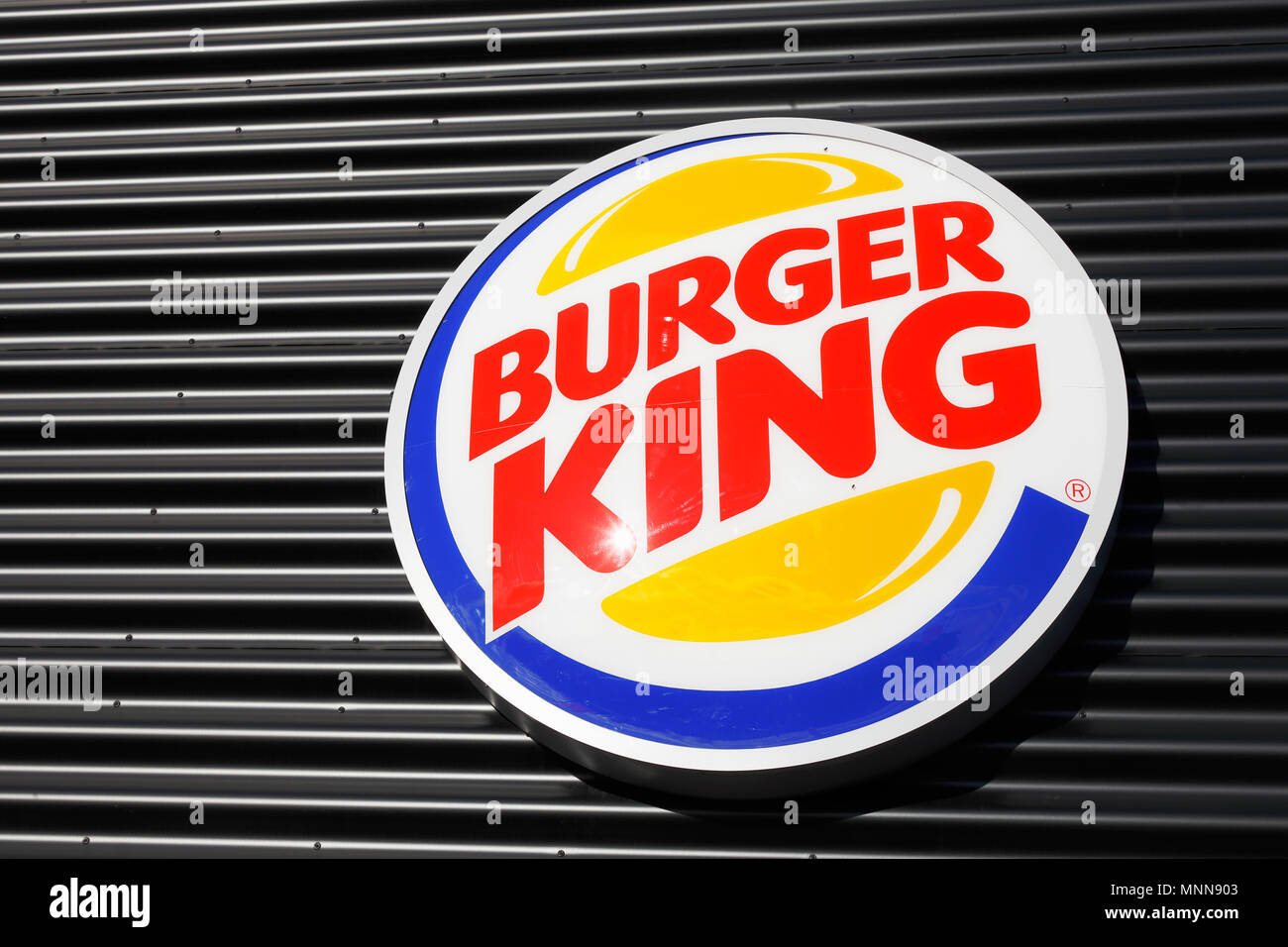 Varnamo, Sweden - November 2, 2017: Close-up of the fast food hamberger restaurant Burger King logo on the wall. Stock Photo