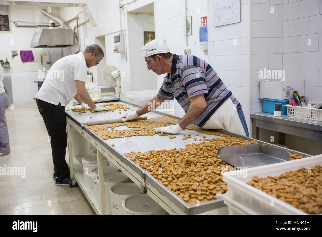 Palermo, Sicily, April 24, 2018: Employees are working in a traditional Sicilian Caramel factory Stock Photo