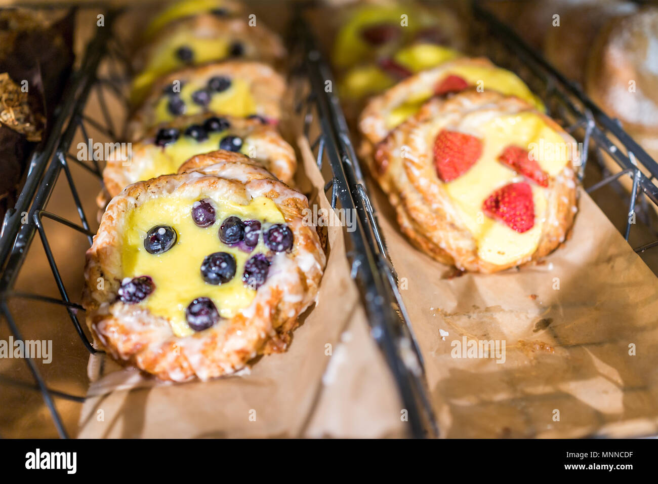 Closeup Of Many Yellow Cream Cheese Berry Fruit Blueberry And Strawberry Baked Danish Pastries On Shelf Tray Display Desserts In Bakery Shop Cafe Stor Stock Photo Alamy