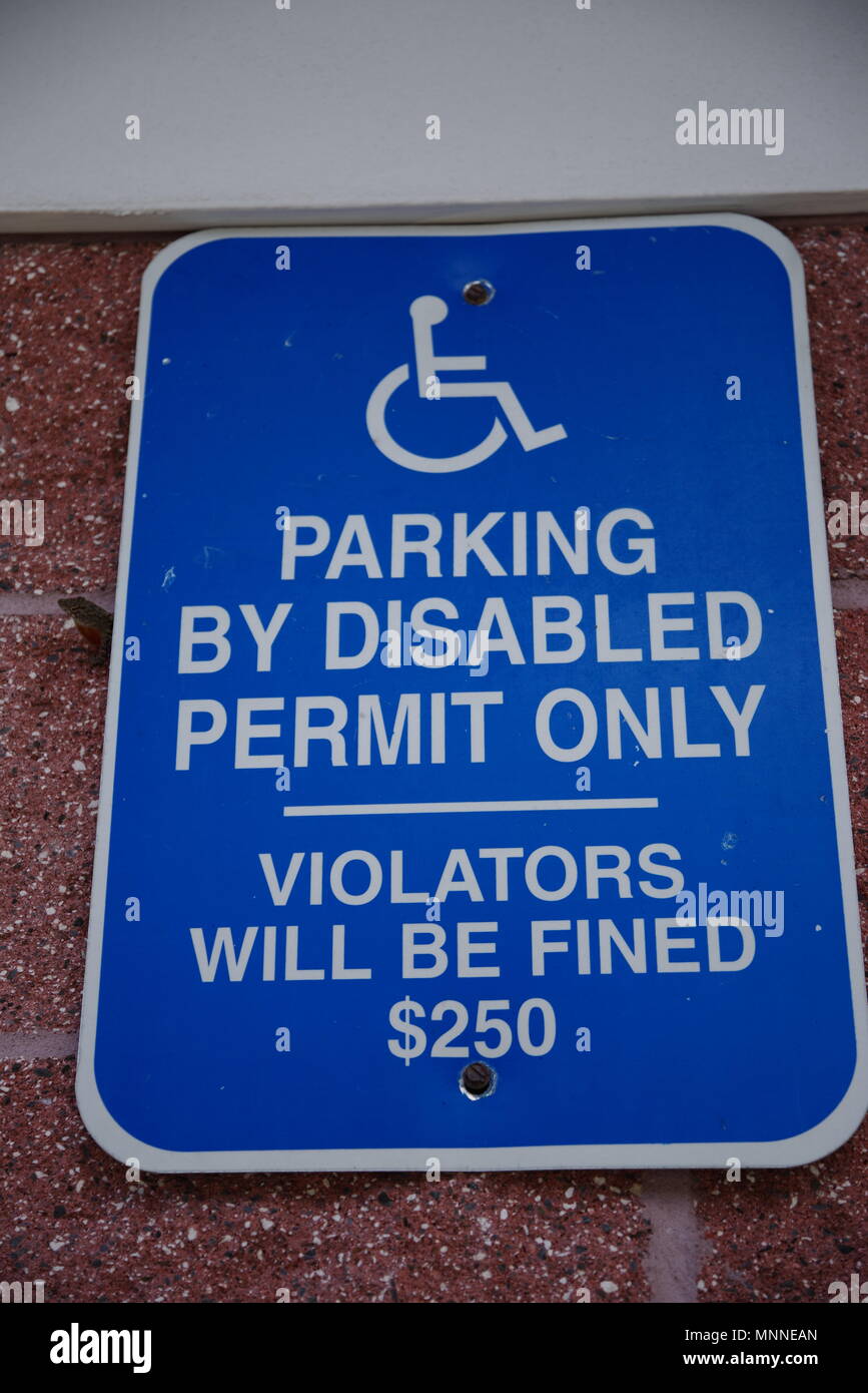 Tampa, Florida / USA - May 5 2018:  Parking By Disabled Permit Only, Violators Will Be Fined $250 Stock Photo