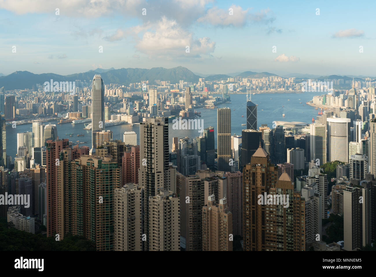 Aerial view of Hong Kong skyline and Victoria Harbor with blue sky in ...