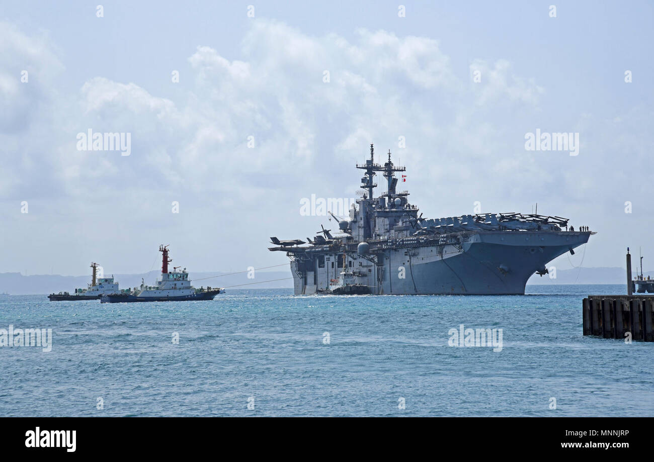 OKINAWA, Japan (March 15, 2018) The amphibious assault ship USS Wasp (LHD 1) arrives at White Beach Naval Facility to embark the 31st Marine Expeditionary Unit (MEU). Wasp, part of the Wasp Expeditionary Strike Group, is conducting a regional patrol designed to strengthen regional alliances, provide rapid-response capability and advance the up-gunned ESG concept. Stock Photo