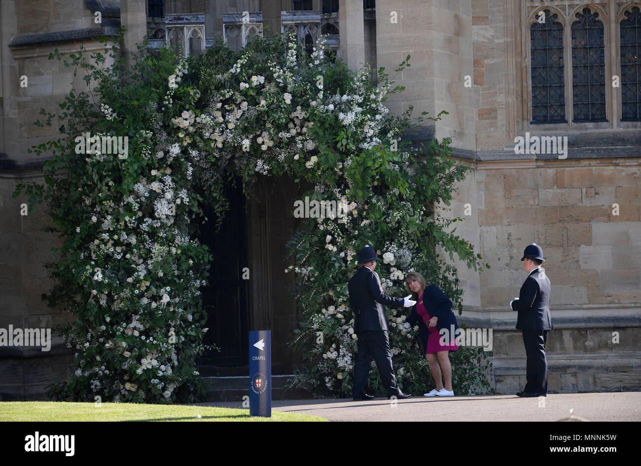 A flower arranger does last-minute preparations within Windsor Castle ahead of the wedding of Prince Harry and Meghan Markle. Stock Photo