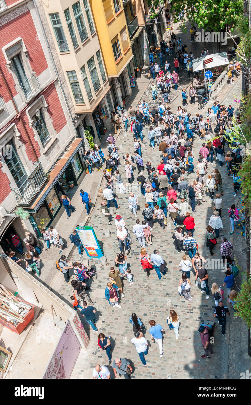 crowd, people walking through the streets of Girona, annual flower festival “Temps de flors 2018”, Girona, Catalonia, Spain Stock Photo
