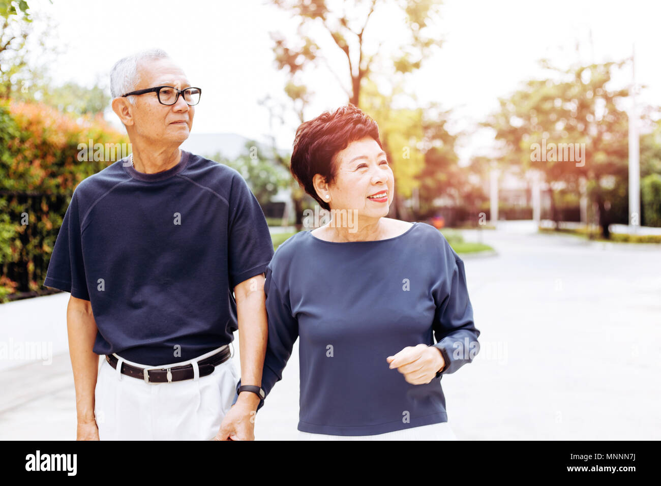 Cheerful chinese couple walking hi-res stock photography and images - Alamy